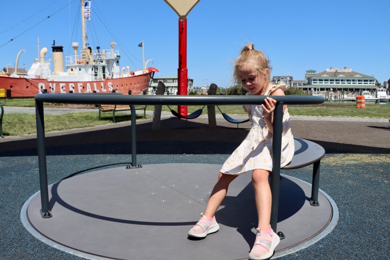 Rowan Herbein, 5, plays at the Canalfront Park playground in Lewes Aug. 22. A parent has asked the city to put a safety fence around the playground over concern that a child could wander into the Lewes-Rehoboth Canal. BILL SHULL PHOTOS